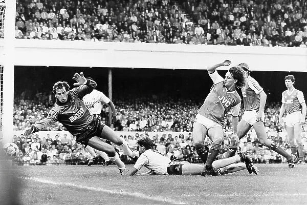 Arsenal's Charlie Nicholas goes close for Arsenal as Spurs keeper Ray Clemence dives in vain