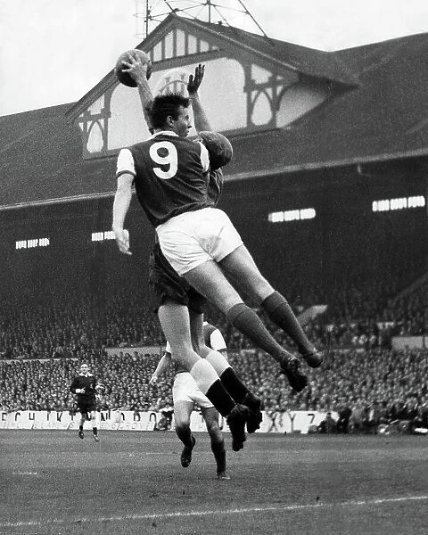 Arsenal's David Court and Spurs goalkeeper Bill Brown fight for the ball 1962