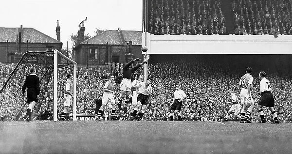 Arsenal's goalkeeper George Swindin clears a cross from the Spurs forwards during the Gunners 2-2 draw at home in 1950