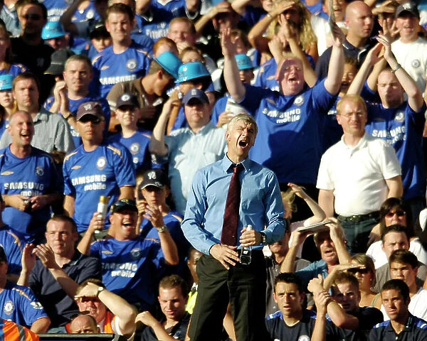 Arsene Wenger as the Chelsea fans celebrate Drogba's goal in the 1-0 win 2005