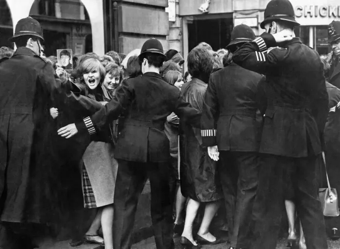 Framed Print : Beatles fans are held back by police Framed Print : Beatles fans are held back by police