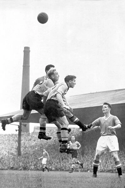 Billy Wright and Bill Shorthouse (Wolverhampton Wanderers) vs Tommy Taylor (Manchester United) at Old Trafford 1955