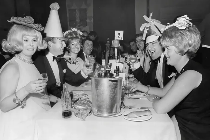 Framed Print : Bobby Moore, and wife Tina Moore across the table from Terry Venables and his wife 1967 at a New Years Party