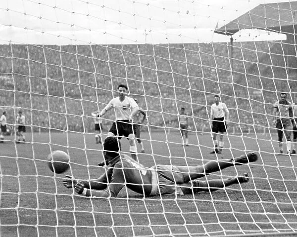 Brazil goalkeeper Gilmar dos Santos Neves saves a penalty from England's Roger Byrne