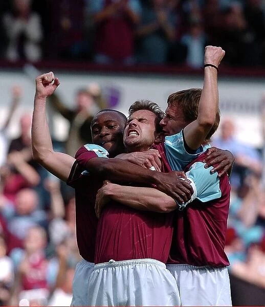 Carl Fletcher of West Ham is congratulated on his goal by team-mates Nigel Reo Coker and Teddy Sheringham