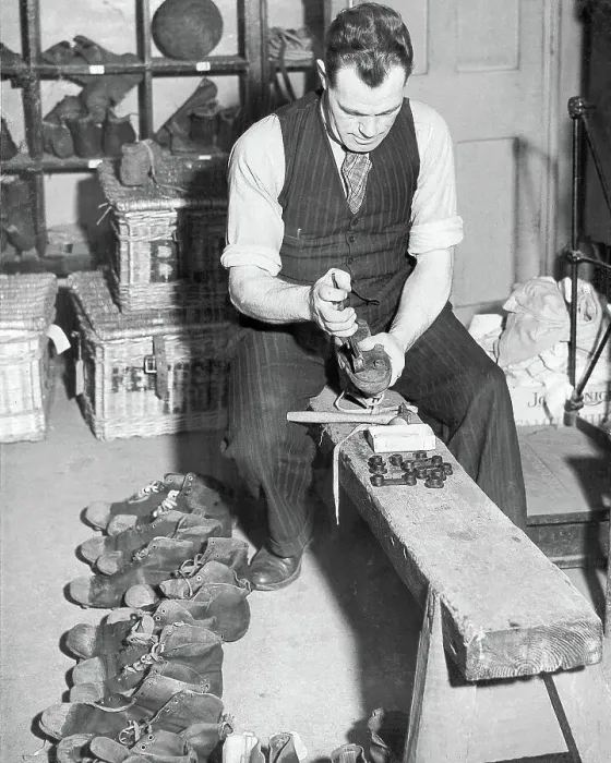 Framed Print : Charlton Athletic trainer Jimmy Trotter replaces the studs teams football boots 1945 Framed Print : Charlton Athletic trainer Jimmy Trotter replaces the studs teams football boots 1945