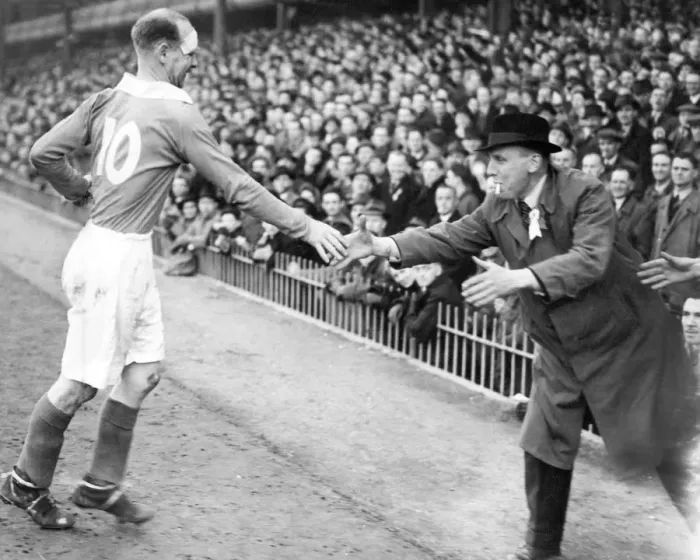 Framed Print : A Charlton supporter dashes out to shake hands with Don Welsh Framed Print : A Charlton supporter dashes out to shake hands with Don Welsh