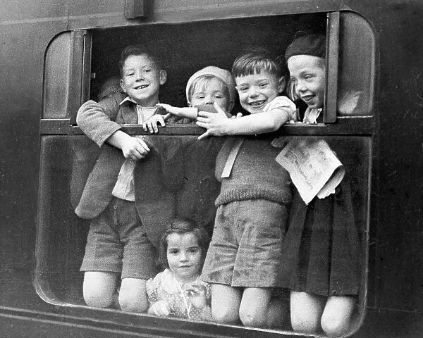 Children waving while being evacuated