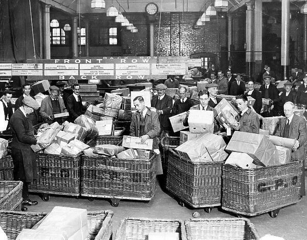 Christmas post 1929. Post Office workers sorting the Christmas overseas