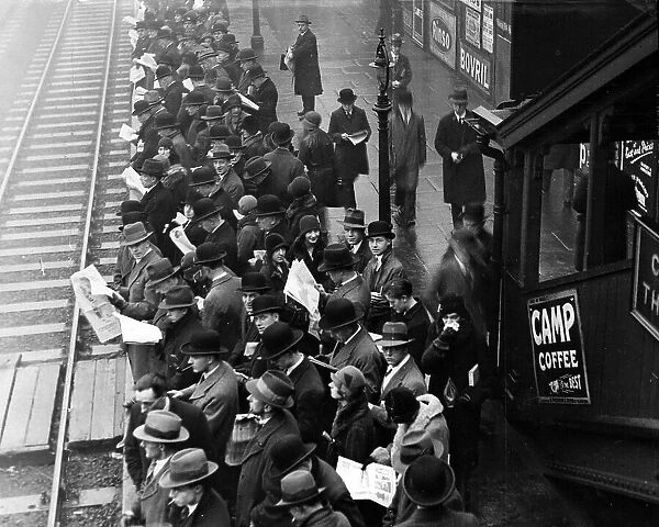 Crowd of commuters on rail platform at Ilford station, 1930