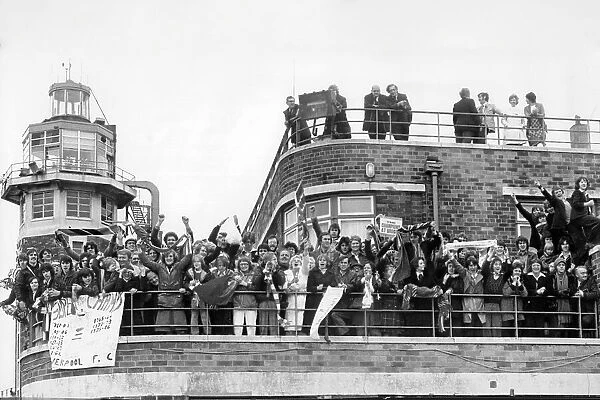 Crowds greet the Liverpool team from rooftops at Liverpool Airport, after winning Football League Cup and UEFA Cup, 1976