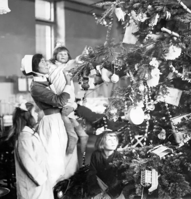 Framed Print : Decorating a Christmas tree 1922 Framed Print : Decorating a Christmas tree 1922