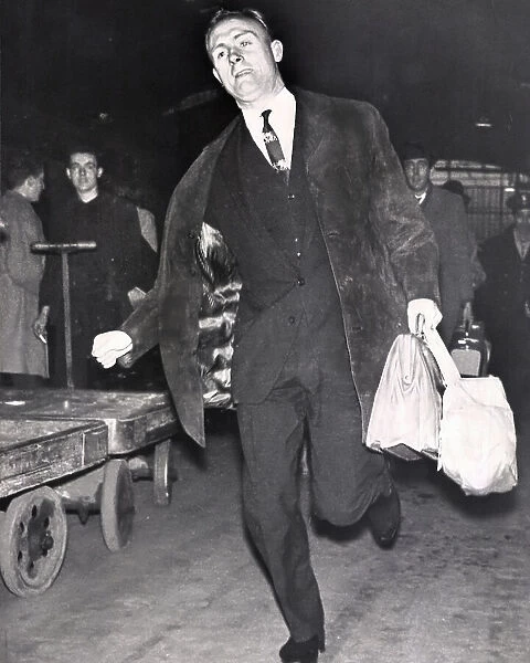 Don Howe rushing to catch a train at Paddington after being told he is playing with the England team 1963