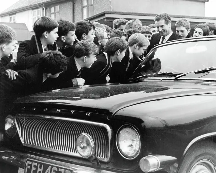 Framed Print : Dudley Kerwick, manager of Nuneaton F.C. with boys of Manor Park Grammar School, listening to the car radio to find out their opponents in the F.A. Cup third round Framed Print : Dudley Kerwick, manager of Nuneaton F.C. with boys of Manor Park Grammar School, listening to the car radio to find out their opponents in the F.A. Cup third round