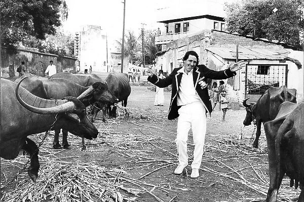 England Cricketer Derek Randall with water buffalo in India