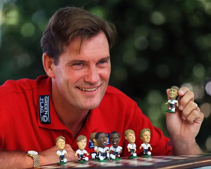 Framed Print : England Manager, Glenn Hoddle playing with miniature figures of the England squad 1997 Framed Print : England Manager, Glenn Hoddle playing with miniature figures of the England squad 1997