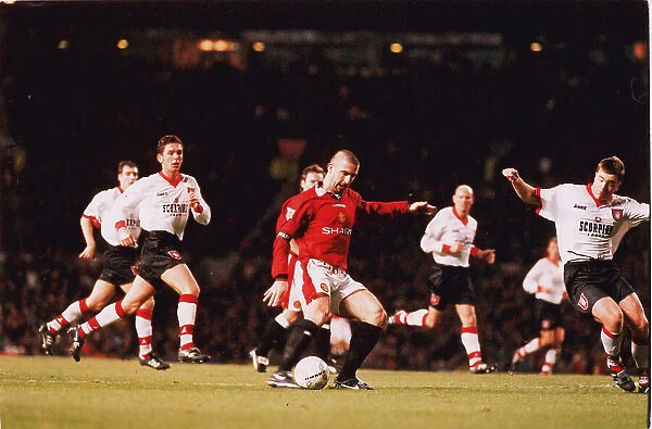 Eric Cantona in action for Manchester United in 1996