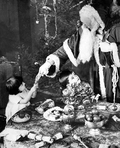 Father Christmas pulling a cracker, 1922