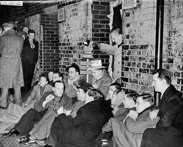 Football fans queue at Highbury overnight for tickets to the Arsenal v Tottenham Hotspur derby in 1949