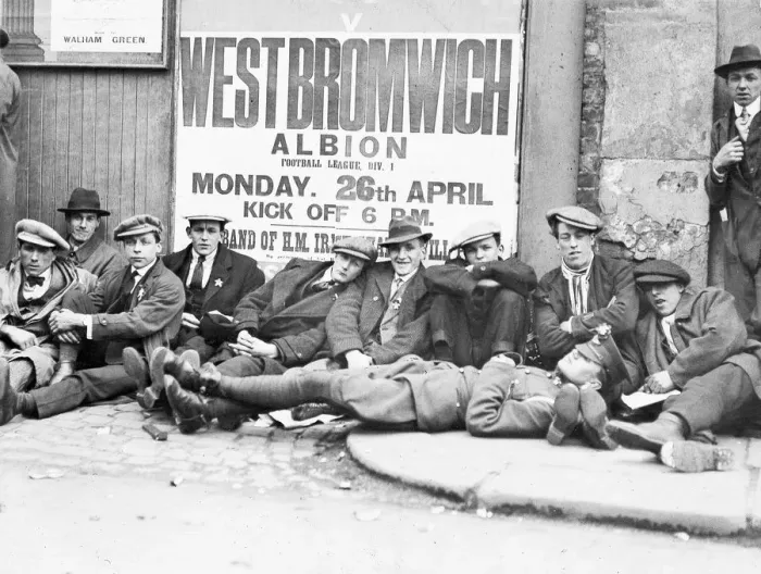 Framed Print : Football fans queue on the morning of a F. A. Cup match outside the Chelsea F. C. ground at Stamford Bridge Framed Print : Football fans queue on the morning of a F. A. Cup match outside the Chelsea F. C. ground at Stamford Bridge