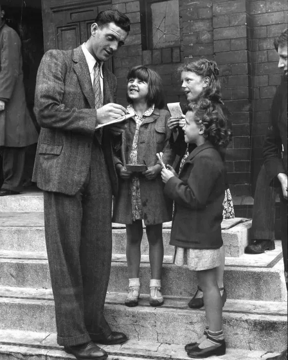 Framed Print : Footballer Eddie McMorran signing autographs 1947 Framed Print : Footballer Eddie McMorran signing autographs 1947