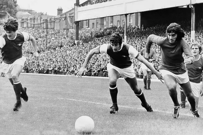 Framed Print : George Best leaves Arsenal's Eddie Kelly and Frank McClintock in his wake. Pat Rice is seen at the far left of the picture Framed Print : George Best leaves Arsenal's Eddie Kelly and Frank McClintock in his wake. Pat Rice is seen at the far left of the picture