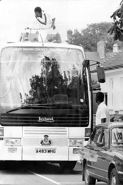Gordon Greenidge on top of the Windies team bus trying to fix the aerial in 1984