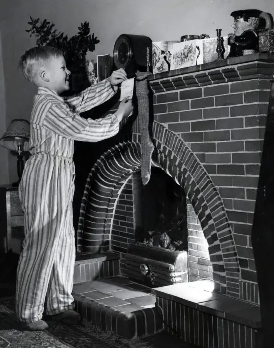 Framed Print : Hanging up his stocking, 1954 Framed Print : Hanging up his stocking, 1954