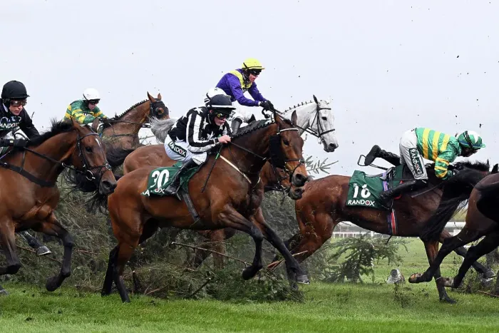 Framed Print : Horses clear the Chair jump on the second day at Aintree 2023. Rider Kevin Brogan fleetingly leaves his horse Phoenix Way Framed Print : Horses clear the Chair jump on the second day at Aintree 2023. Rider Kevin Brogan fleetingly leaves his horse Phoenix Way