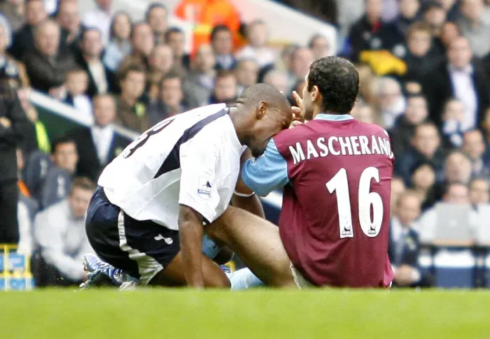 Framed Print : Javier Mascherano of West Ham reacts after after he was bitten by Spurs Jermain Defoe Framed Print : Javier Mascherano of West Ham reacts after after he was bitten by Spurs Jermain Defoe