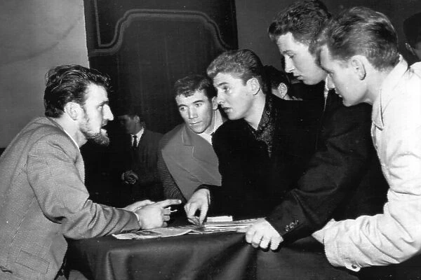 Jimmy Hill, chairman of the footballers union, the P. F. A. talking with Aston Villa players