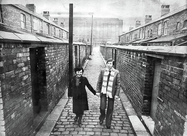 Kazimierz Deyna Polish footballer with his wife Mariola, on a street in front of Manchester City Football Ground, Maine Road 1978