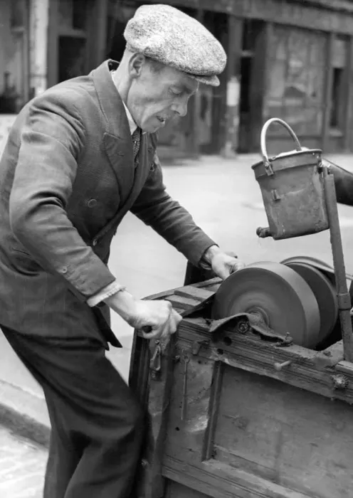 Framed Print : A knife grinder at work, 1946 Framed Print : A knife grinder at work, 1946