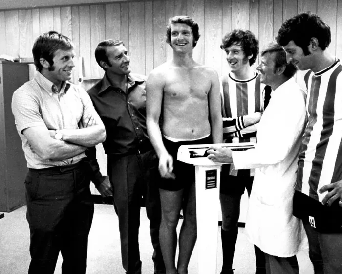 Framed Print : Manchester City player Mike Doyle weighs in Framed Print : Manchester City player Mike Doyle weighs in