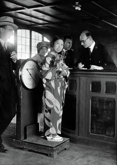 Framed Print : Miki, the Japanese artiste, standing with her dog on the scales at Le Bourget Airport, Paris 1928 Framed Print : Miki, the Japanese artiste, standing with her dog on the scales at Le Bourget Airport, Paris 1928