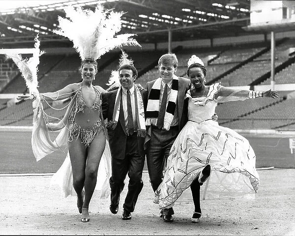 Mirandinha and Neil McDonald of Newcastle United, with samba dancers
