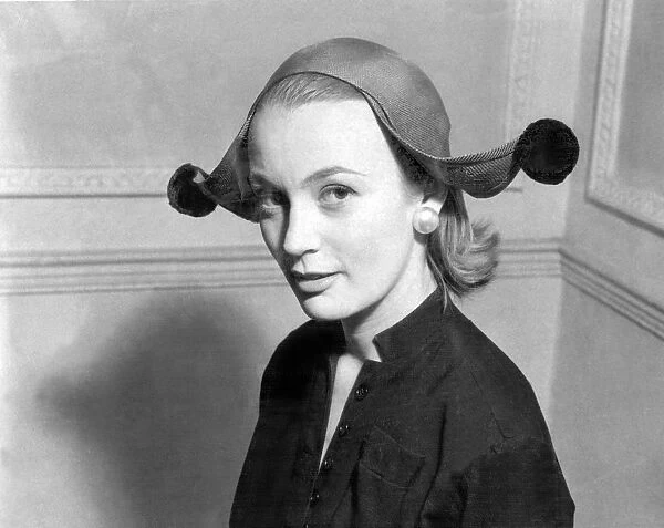 Model wearing jester style hat 1955