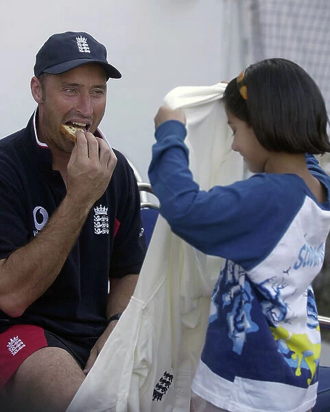 Nasser Hussain gives his shirt to a local girl after the game