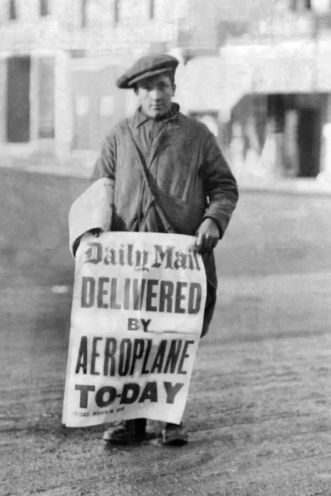 Framed Print : A newspaper boy with a sign Framed Print : A newspaper boy with a sign
