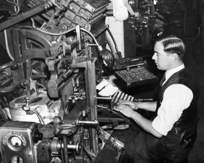 Framed Print : A newspaper compositor at work