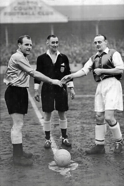 Notts County captain Tommy Deans, referee J.W. Topliss and Sheffield Wednesday captain Eddie Gannon during FA 4th round replay 1955