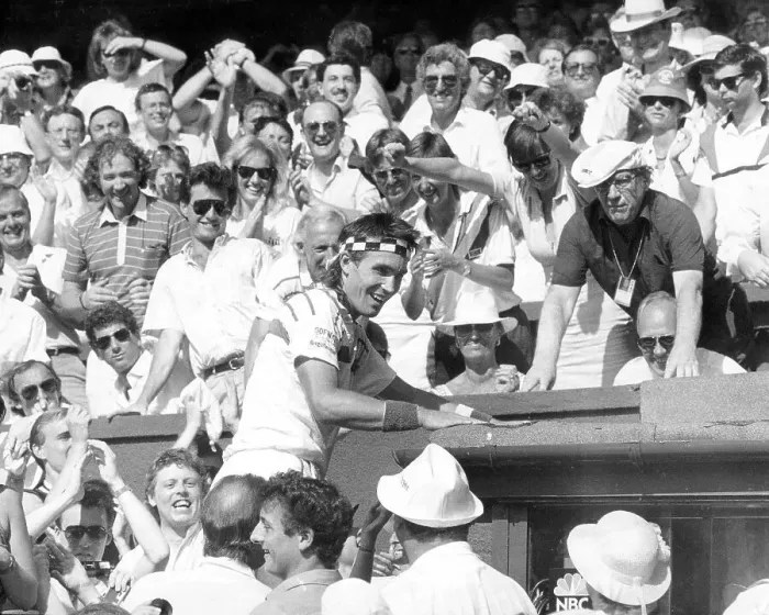 Framed Print : Pat Cash climbs into the crowd to greet his family