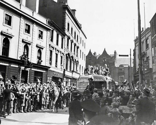 The people of Wolverhampton line the streets as the team bring home the F.A cup after Wolverhampton Wanderers beat Leicester at Wembley in 1949