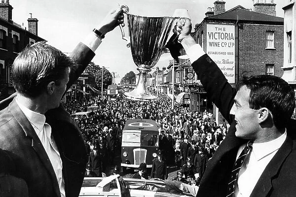 Peter Baker, left, and Jimmy Greaves with the European Cupwinners cup on their victory parade through North London 1963