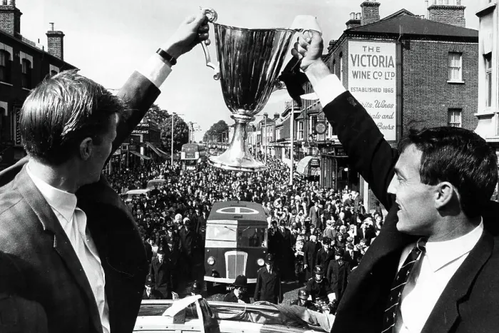 Framed Print : Peter Baker, left, and Jimmy Greaves with the European Cupwinners cup on their victory parade through North London 1963
