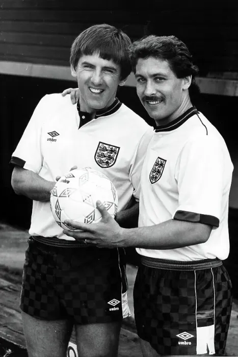 Framed Print : Peter Beardsley and Kenny Samson show off the new England football strip 1987 Framed Print : Peter Beardsley and Kenny Samson show off the new England football strip 1987