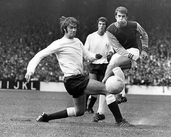 Peter Collis, Roger Morgan and Geoff Hurst in action during a Tottenham Hotspur v West Ham match 1969