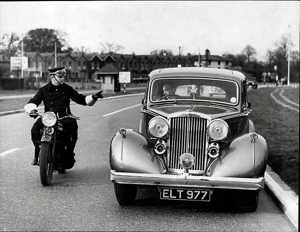 Pulled Over. Motorcycle Police officer stopping a car 1938