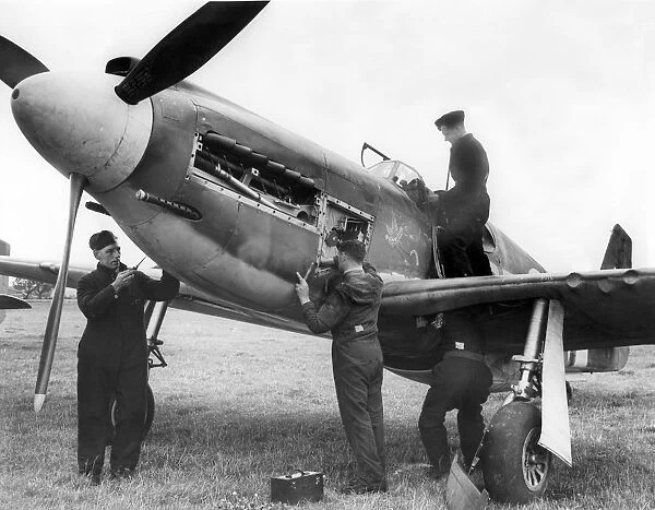 RAF mechanics working on an American Mustang aircraft
