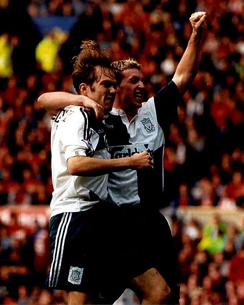 Robbie Fowler celebrates his first goal with Jason McAteer during Manchester United 2 v Liverpool 2 1995